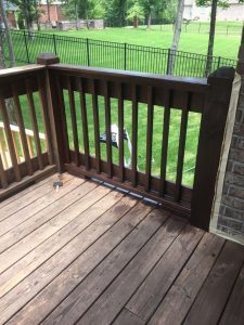 Re-staining the original deck, the first railing is done... what a difference!