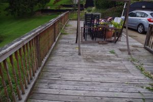 BEFORE: This deck is tattered and unsafe. (original to our home)