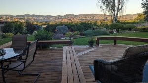 From my vantage point, I can enjoy the deck, the landscaping, and the Boise Mountains all in one panoramic shot.
