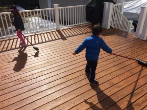 Deck-stained-Annika-Graham-sweeping-3